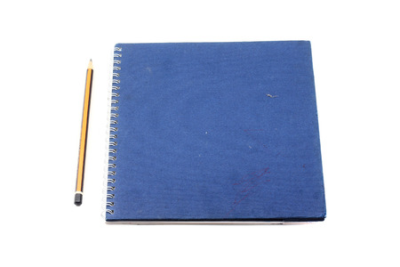 blue book diary and pencil isolate on white backgroundの写真素材