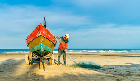 KUANTAN, MALAYSIA - 23 OCT - Fishermen do their work near Beserah beach, Kuantan, Malaysia at 23 October 2012. Fishermen are the main occupation for villagers at Kuantan village, Pahangのeditorial素材
