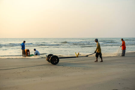 KUANTAN, MALAYSIA - JULY 20, 2014 - Fishermen do their work near Beserah beach, Kuantan, Malaysia at July 20, 2014. Fishermen are the main occupation for villagers at Kuantan village, Pahangのeditorial素材