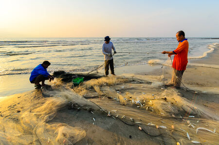 KUANTAN, MALAYSIA - JULY 20, 2014 - Fishermen do their work near Beserah beach, Kuantan, Malaysia at July 20, 2014. Fishermen are the main occupation for villagers at Kuantan village, Pahangのeditorial素材