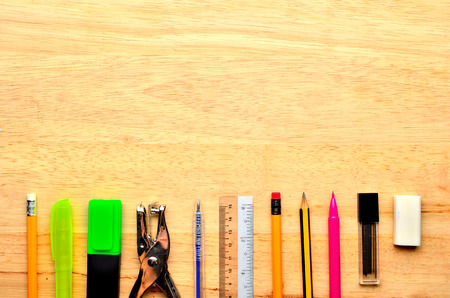 Assortment of various school items on wooden backgroundの写真素材