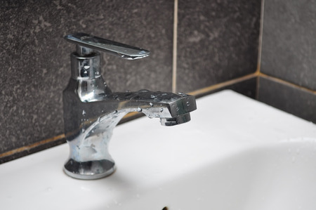 modern tap in bathroom closeup imageの写真素材