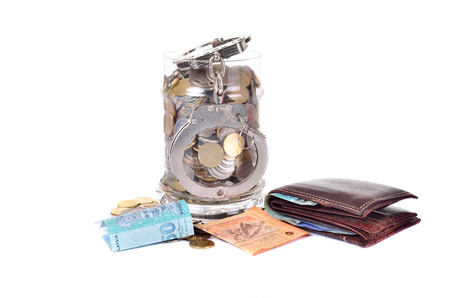 Cash money and handcuffs. the concept of crime and corruption