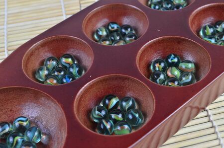 Congklak (selective focus and shallow DOF) is a traditional game in asiaの写真素材