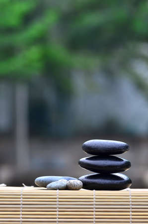 Pebble stones on nature bokeh background - SPA Conceptの写真素材