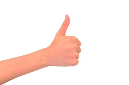 Woman hand with thumb up isolated on white background