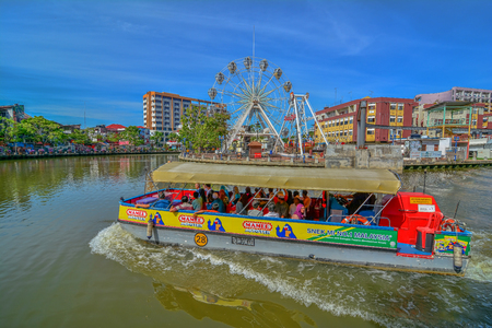 MALACCA, MALAYSIA - JAN 31, 2016 : Cruise tour boat sails on the Malacca River in Malacca. Rehabilitation of the Malacca River to develop river tourism started in July 2002のeditorial素材