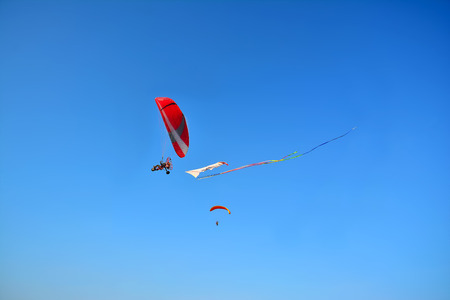 Paragliding in the skyの写真素材