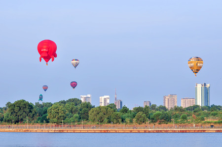 PUTRAJAYA, MALAYSIA - MARCH 13, 2016 - Hot air balloon floats over blue skies at the 8th Putrajaya International Hot Air Balloon Fiesta in Putrajaya, Malaysia on March 13, 2016のeditorial素材