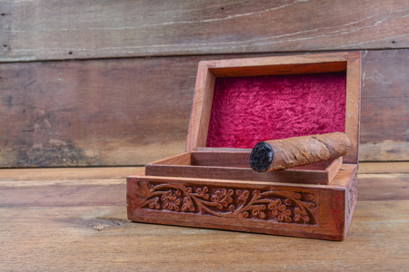 Cigar on wooden box