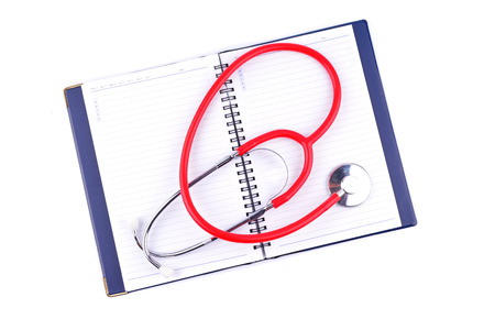 Stethoscope on notebooksの写真素材