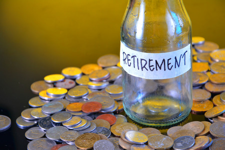 The word Retirement with stacked coinsの写真素材
