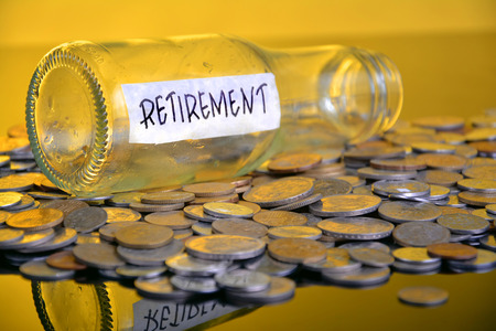 The word Retirement with stacked coinsの写真素材