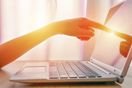Business woman touching screen of laptopの写真素材