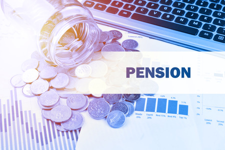Coins spilling out of jar on the business stock charts with label Pensionの写真素材