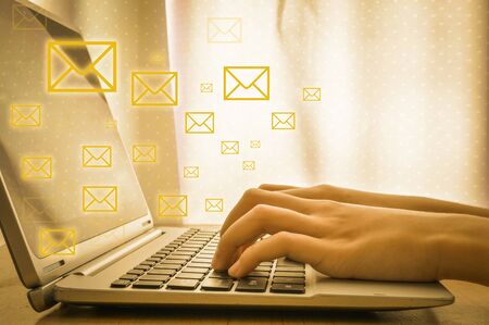 Email concept with laptop and hands