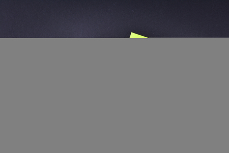 Green sticky note with pen with text BUSINESS MARKETINGの写真素材