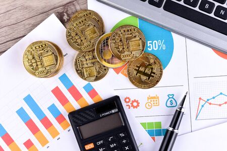 Financial growth concept. Histogram with Bitcoin, keyboard and printed graph. Photo new virtual...