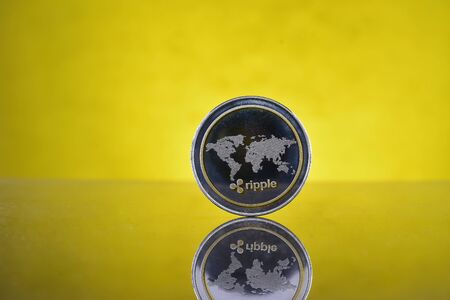 Physical version of Ripple, new virtual money. Conceptual image for worldwide cryptocurrency and digital payment system called the first decentralized digital currencyの写真素材