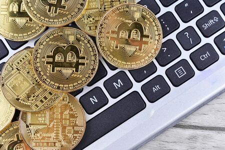 Golden Coins on a laptop keyboard. Cryptocurrencyの写真素材