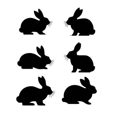 Rabbits silhouettes. Black and white vector illustration isolated on white background.のイラスト素材
