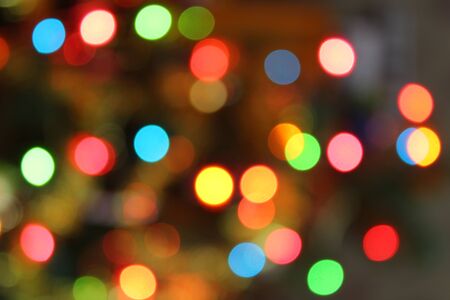 Abstract christmas background with christmas tree with decorations, defocused bokeh lights.の写真素材