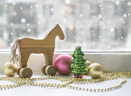 Christmas vintage toys against  window, winter holiday  background.の写真素材