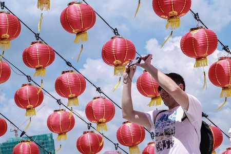 Kuala Lumpur, Malaysia, January 30, 2016 - Tourist taking a photograph of decoration for Chinese New Year in Thean Hau Temple, Kuala Lumpur.のeditorial素材