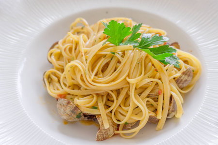 Close up Italian seafood pasta in white plateの写真素材