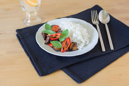 Stir-fried aubergine with chili and holy basil served with rice/ vegetarian foodの写真素材