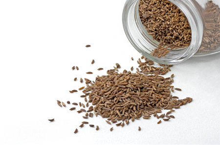 Isolated closeup cumin seeds in the jarの写真素材