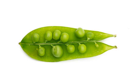 Green peas on a white background, top view.の写真素材
