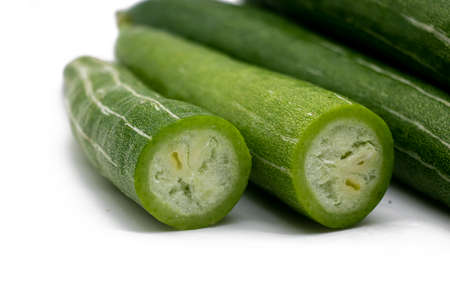 whole and slices Snake gourd isolated on white background