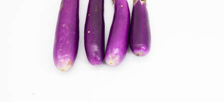 fresh purple eggplant chopped, fresh eggplant isolated on white backgroundの写真素材