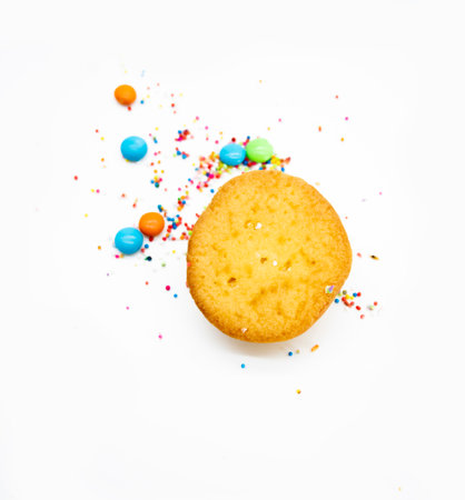 selective focus, yellow muffin cupcake design by colourful sprinkle isolated on white background, lemon flavourの写真素材