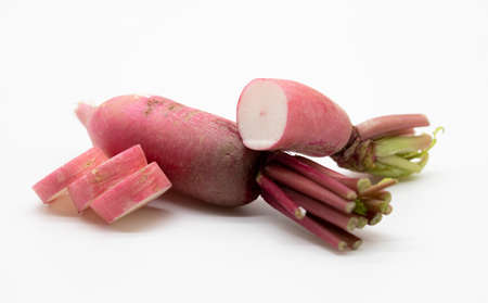 daikon radishes isolated slices on white background. red radish.の写真素材