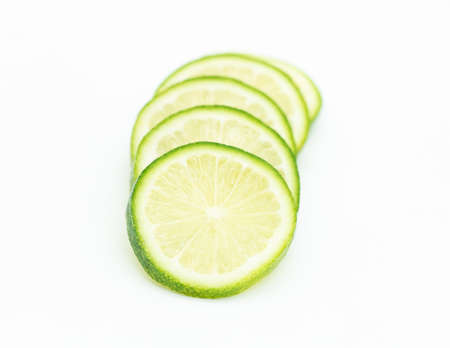 round slice Lemons isolated on white backgroundの写真素材