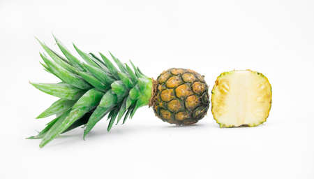 whole and slice pineapple with leaves isolated on white background, Flat lay.selective focusの写真素材