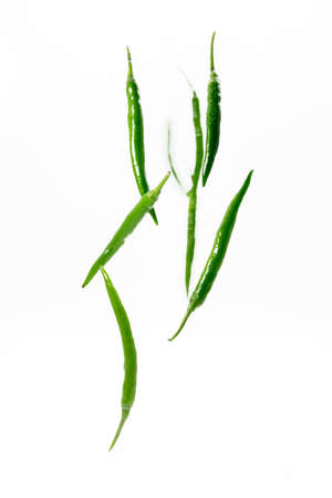 green chili pepper flying isolated on white background