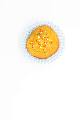 muffin cake with sprinkle isolate on white background, top view