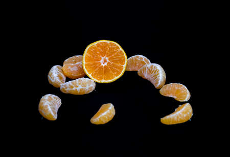 kamala or Tangerine on black background, selective focusの写真素材
