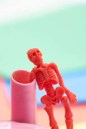 plastic toy skeletons isolate on background.creative background halloween minimalismの写真素材
