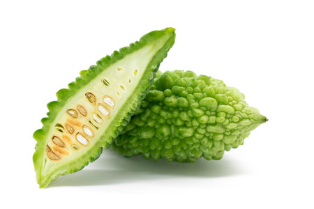 fresh Bitter melon or Bitter gourd slices isolated on white backgroundの写真素材