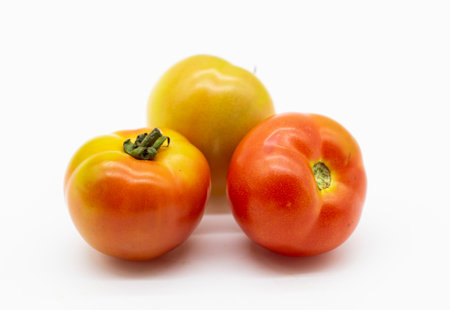 organic tomatoes isolated on white backgroundの写真素材