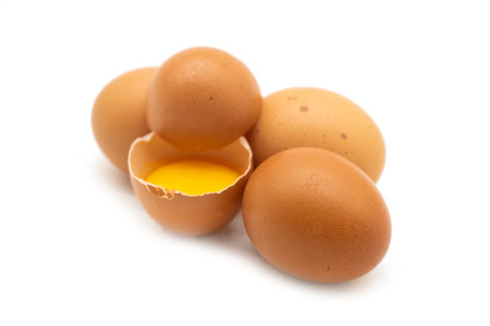 whole eggs and broken isolated on a white background.の写真素材
