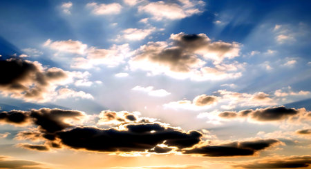 sunset sky with clouds and rays of light, abstract nature backgroundの素材
