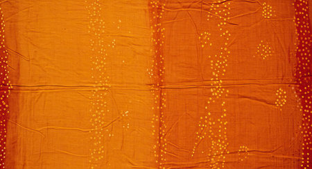 Orange fabric with a pattern of dots. Background and texture for design.