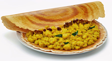 Pancakes with curry on a plate isolated on white background.