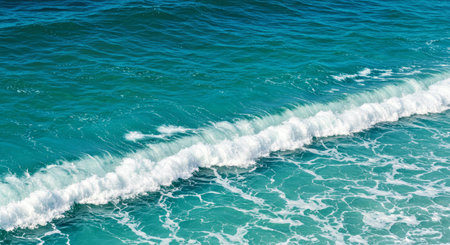 Gentle Marine Blue Waves Breaking Softly On Shore Smooth Serene Ocean Water Texture Background Coastal Calmの写真素材