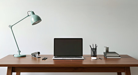 Modern workspace with laptop, stationery and coffee cup on wooden tableの写真素材